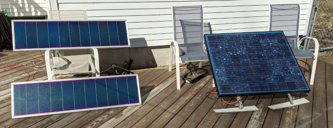 Two 32 watt panels (left), and one 100 watt panel (right).  Yes, the deck needs work.