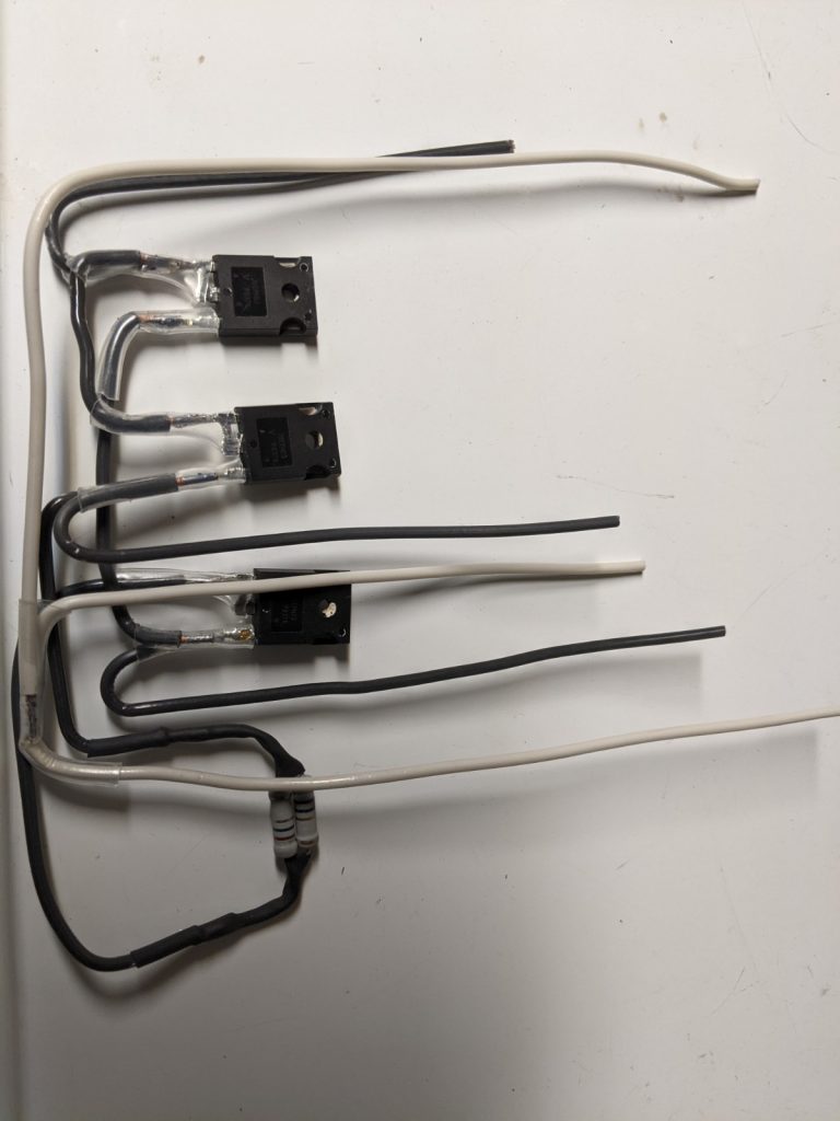 The circuit shown in the schematic, wired together by soldering bits of Romex wire to the components.